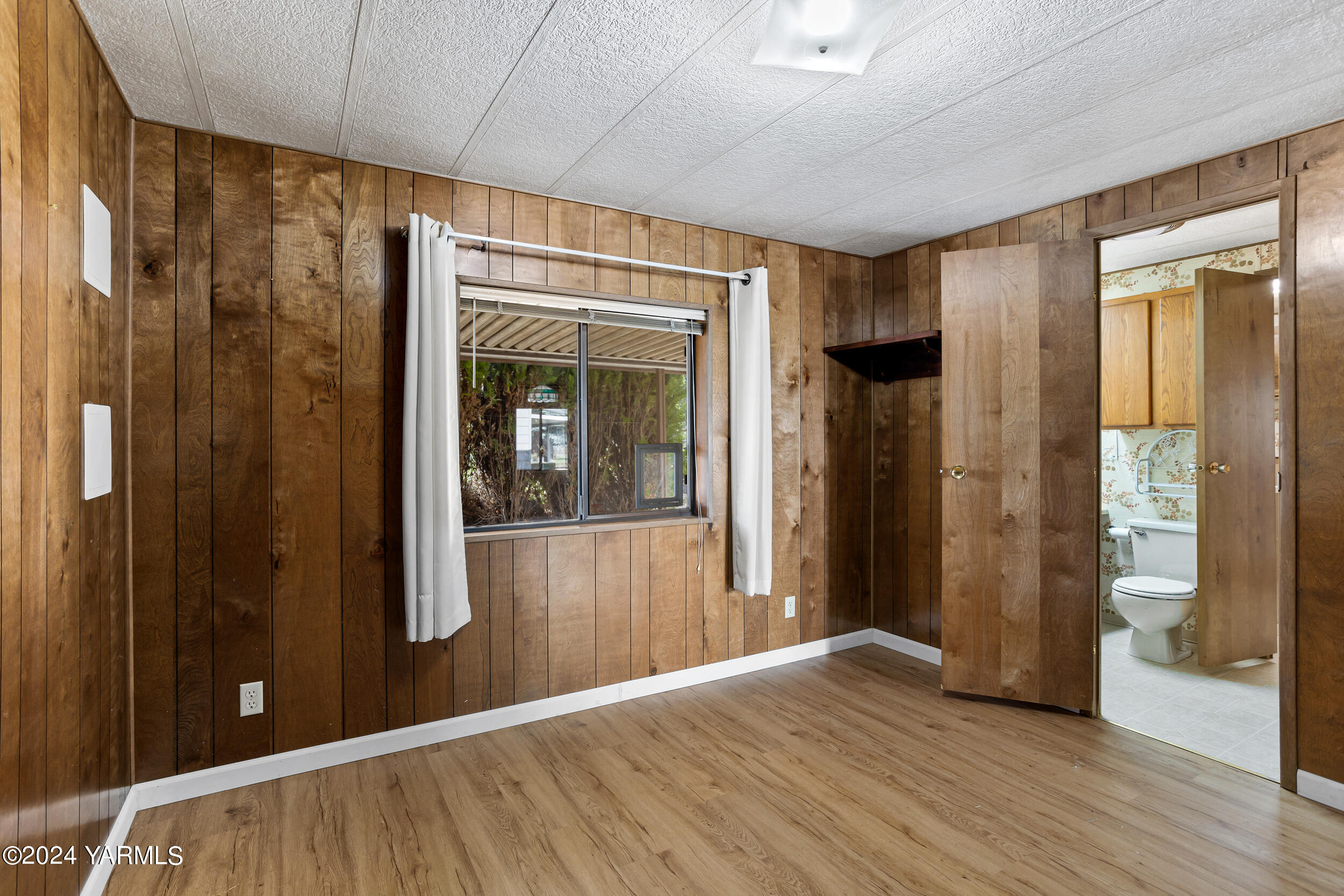 3701 Gun Club Road, Unit 28 Yakima, WA 98901 - Photo 16 of 28 a view of a hallway with wooden floor and staircase
