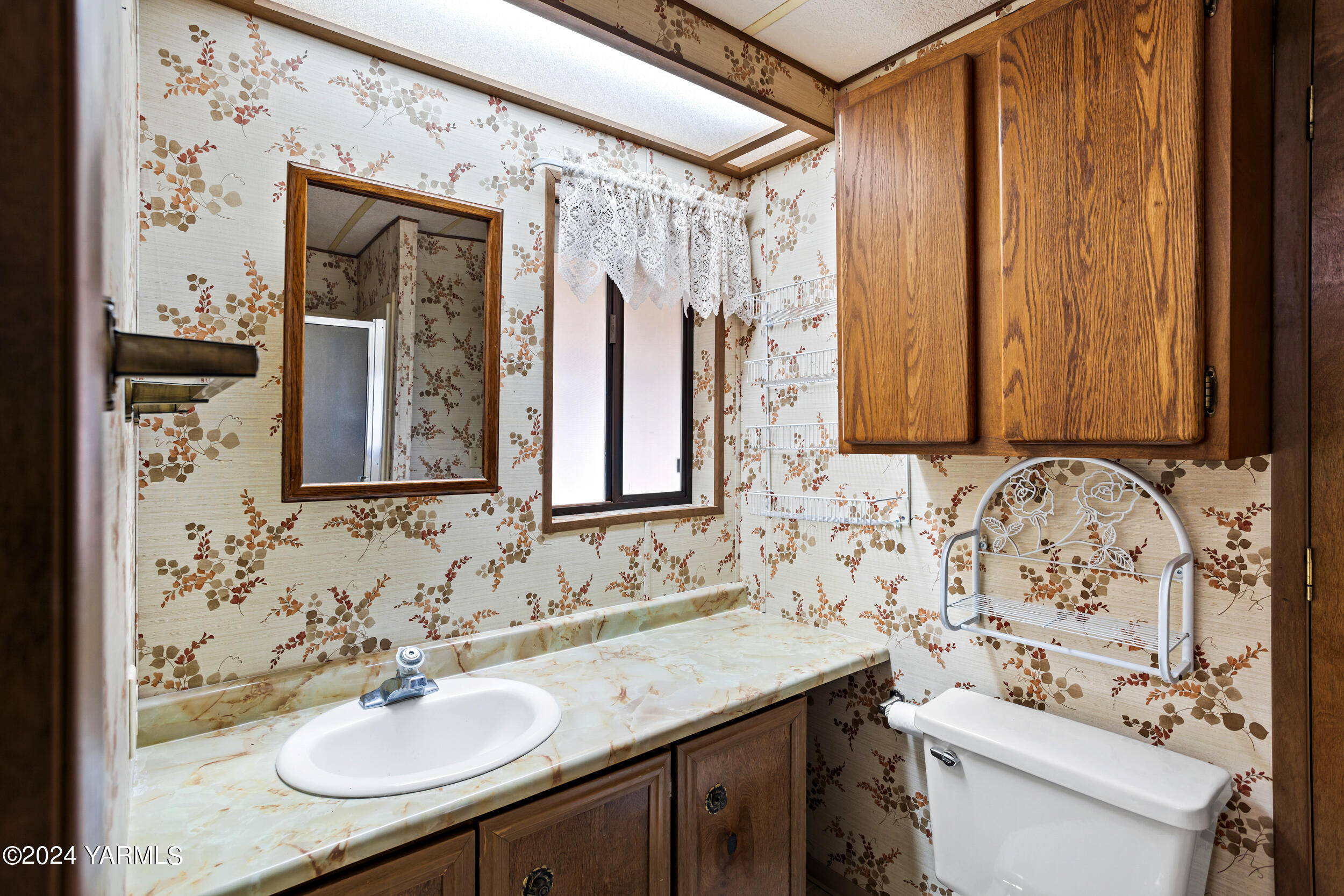 3701 Gun Club Road, Unit 28 Yakima, WA 98901 - Photo 17 of 28 a bathroom with a sink and a mirror