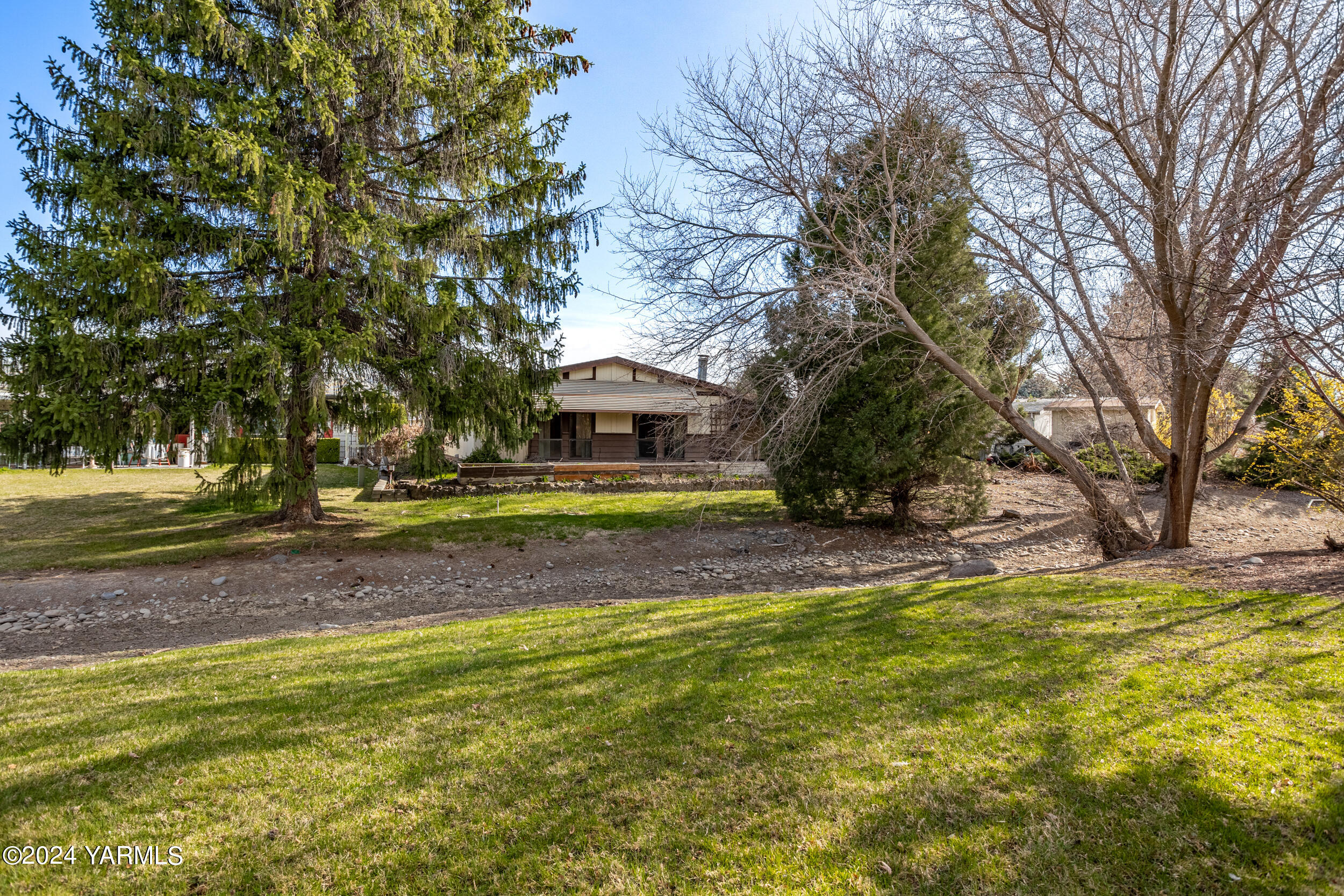 3701 Gun Club Road, Unit 28 Yakima, WA 98901 - Photo 3 of 28 a view of swimming pool with outdoor seating and yard