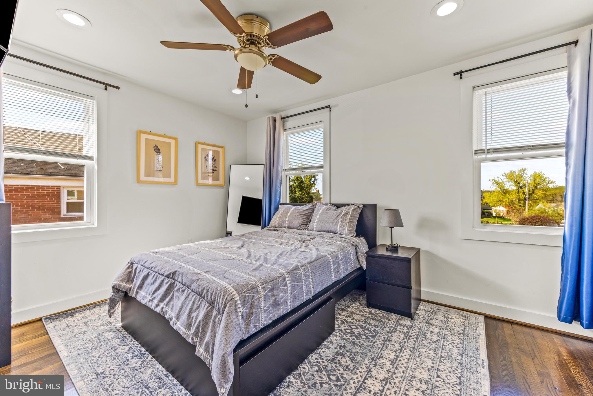 57 Upmanor Road Baltimore, MD 21229 - Photo 12 of 27 a bedroom with a bed and a window