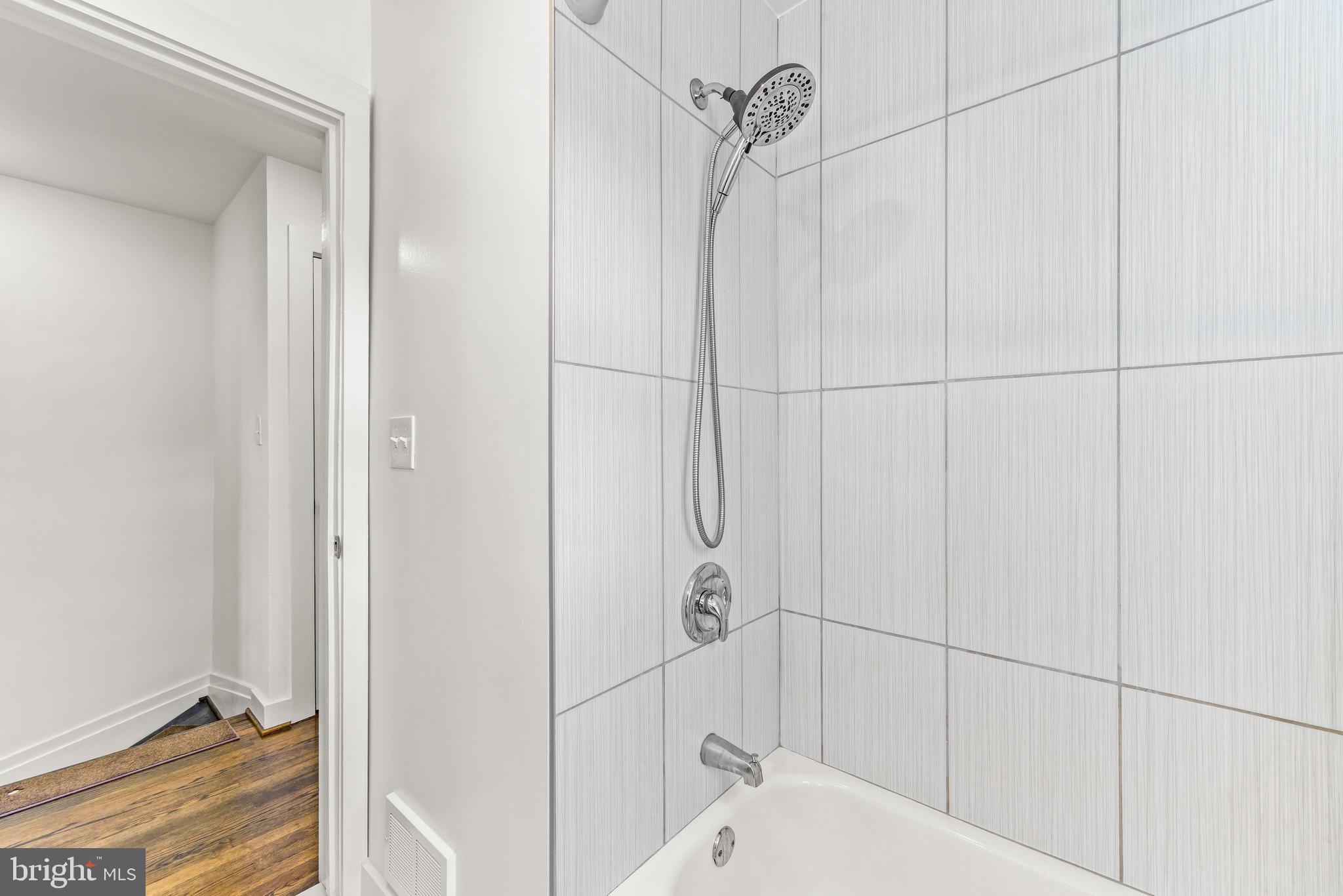 57 Upmanor Road Baltimore, MD 21229 - Photo 16 of 27 a bathroom with a bathtub