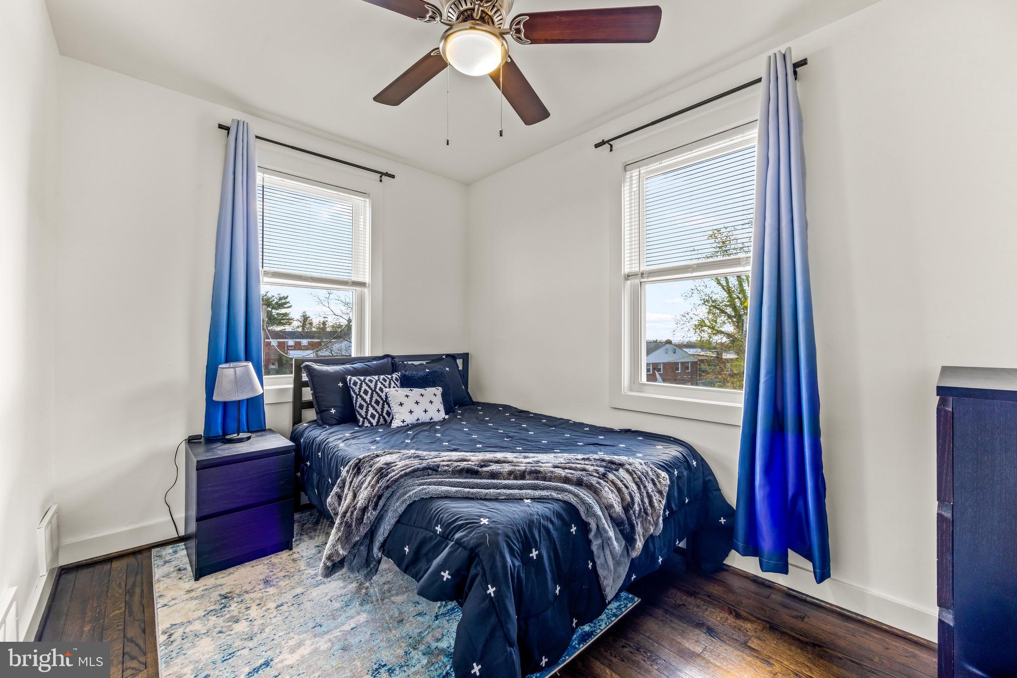 57 Upmanor Road Baltimore, MD 21229 - Photo 17 of 27 a bed sitting in a bedroom next to a window