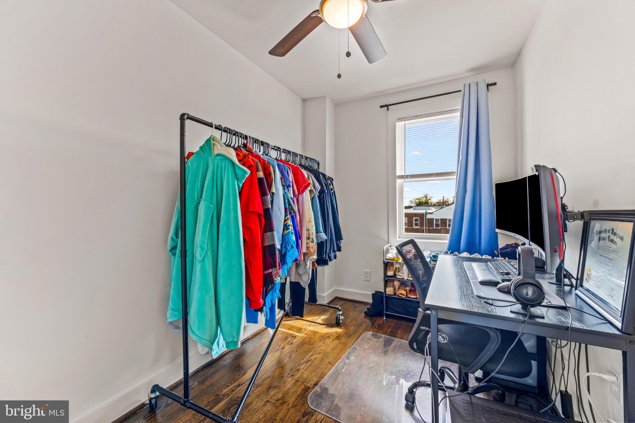 57 Upmanor Road Baltimore, MD 21229 - Photo 19 of 27 a view of a workspace with furniture and a window