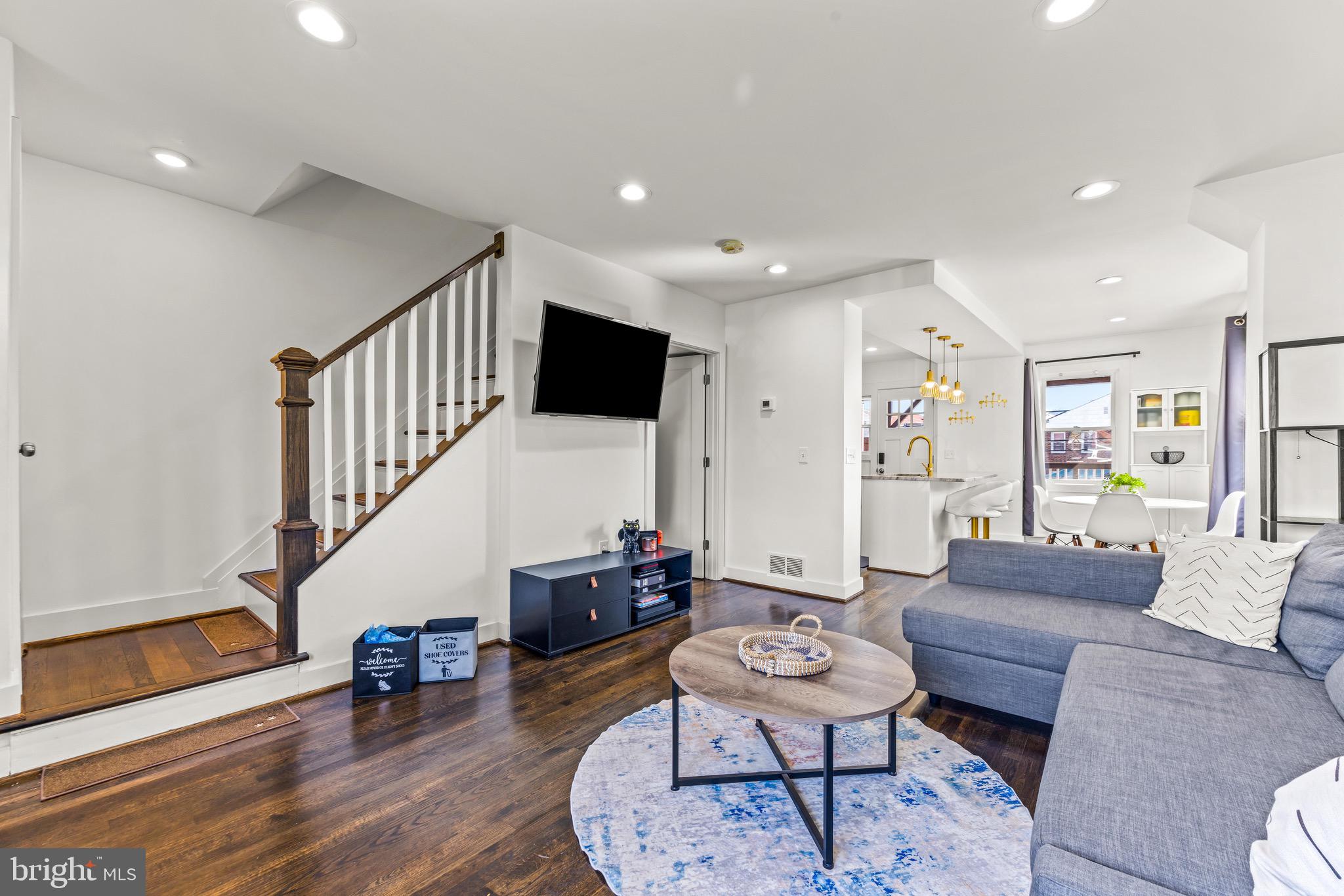57 Upmanor Road Baltimore, MD 21229 - Photo 2 of 27 a living room with furniture and a wooden floor
