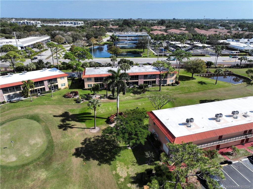 1961 Southwest Palm City Road, Unit F Stuart, FL 34994 - Photo 25 of 29 an aerial view of a house with yard swimming pool and outdoor seating
