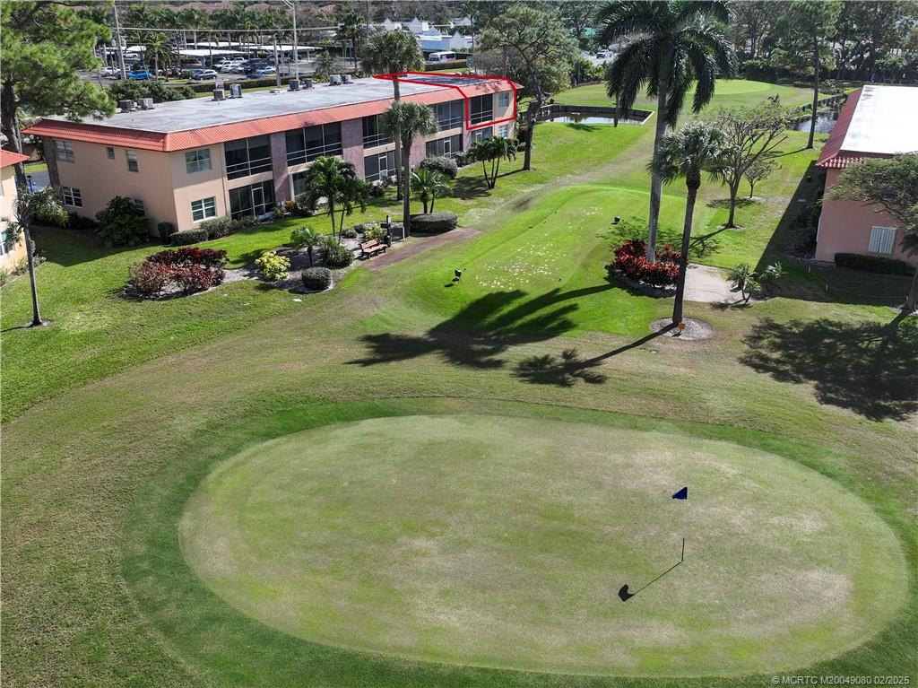 1961 Southwest Palm City Road, Unit F Stuart, FL 34994 - Photo 26 of 29 an aerial view of a house with a yard