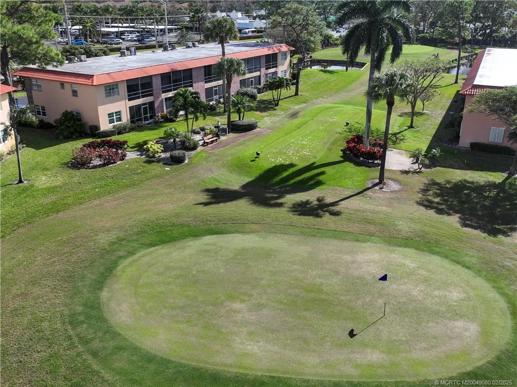 1961 Southwest Palm City Road, Unit F Stuart, FL 34994 - Photo 27 of 29 an aerial view of a house with a yard