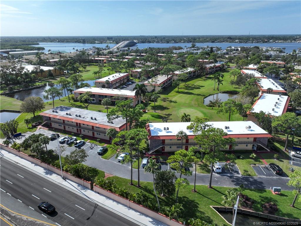 1961 Southwest Palm City Road, Unit F Stuart, FL 34994 - Photo 29 of 29 an aerial view of residential houses with outdoor space