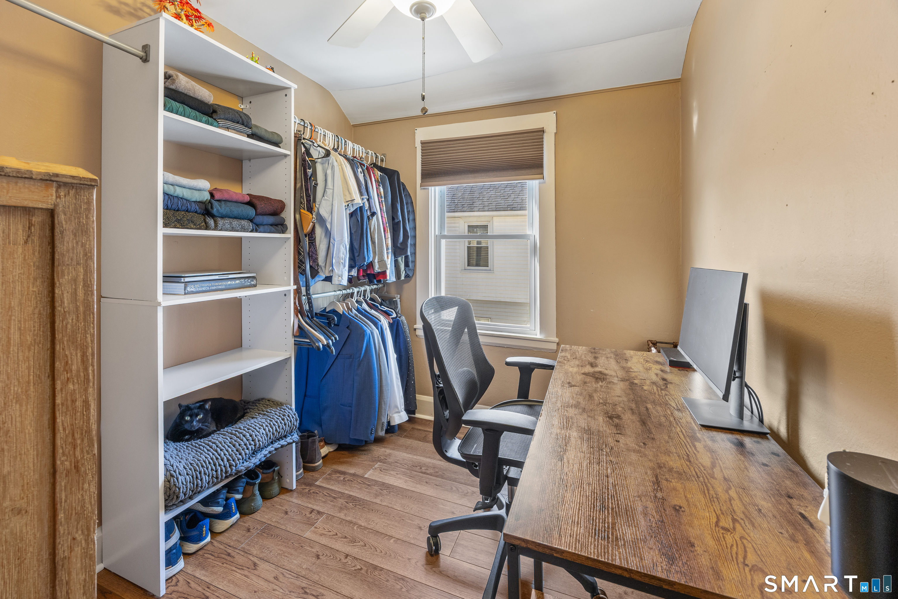 105 Greene Street Bristol, CT 06010 - Photo 14 of 39 a view of a bedroom with workspace and bedroom