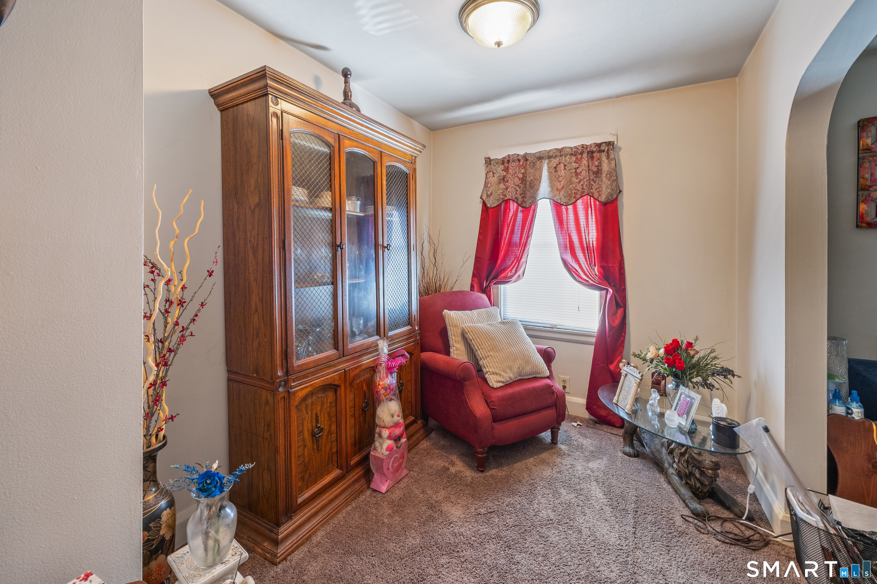 105 Greene Street Bristol, CT 06010 - Photo 28 of 39 a living room with furniture a rug and a flat screen tv