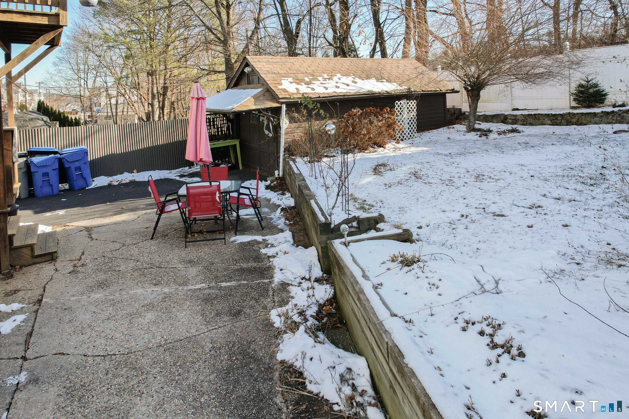 105 Greene Street Bristol, CT 06010 - Photo 36 of 39 a view of a chairs and tables in the back yard of the house