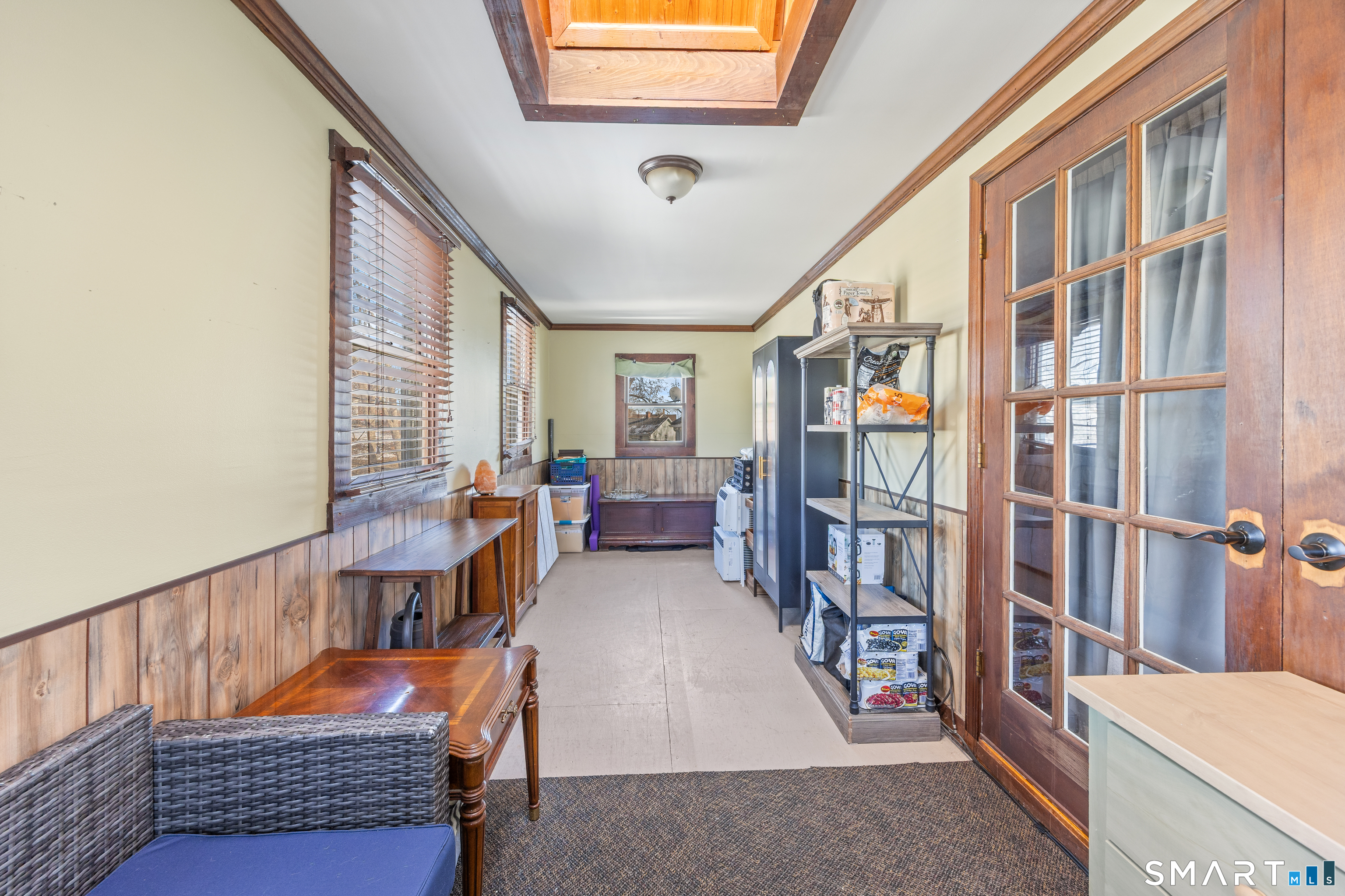 105 Greene Street Bristol, CT 06010 - Photo 7 of 39 a view of front door with furniture and a window