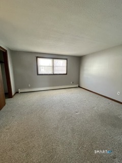 1370 Highland Avenue, Unit 5 Waterbury, CT 06708 - Photo 11 of 15 an empty room with a empty space and windows