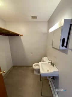 1370 Highland Avenue, Unit 5 Waterbury, CT 06708 - Photo 11 of 15 a bathroom with a sink a toilet and mirror