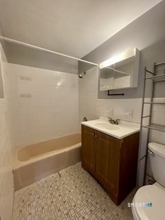 1370 Highland Avenue, Unit 5 Waterbury, CT 06708 - Photo 12 of 15 a bathroom with a sink mirror vanity and toilet