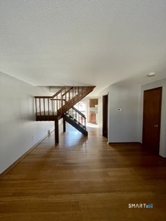 1370 Highland Avenue, Unit 5 Waterbury, CT 06708 - Photo 3 of 15 a view of entryway livingroom and hall with wooden floor