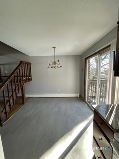 1370 Highland Avenue, Unit 5 Waterbury, CT 06708 - Photo 4 of 15 a view of an empty room with wooden floor