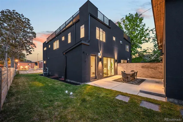 a bedroom with a bed and painting on the wall