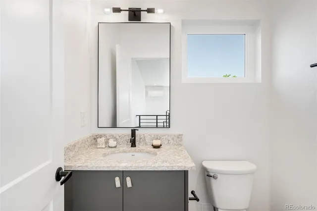 a view of a patio with a table and chairs