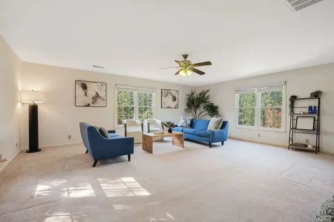 a living room with furniture and a window