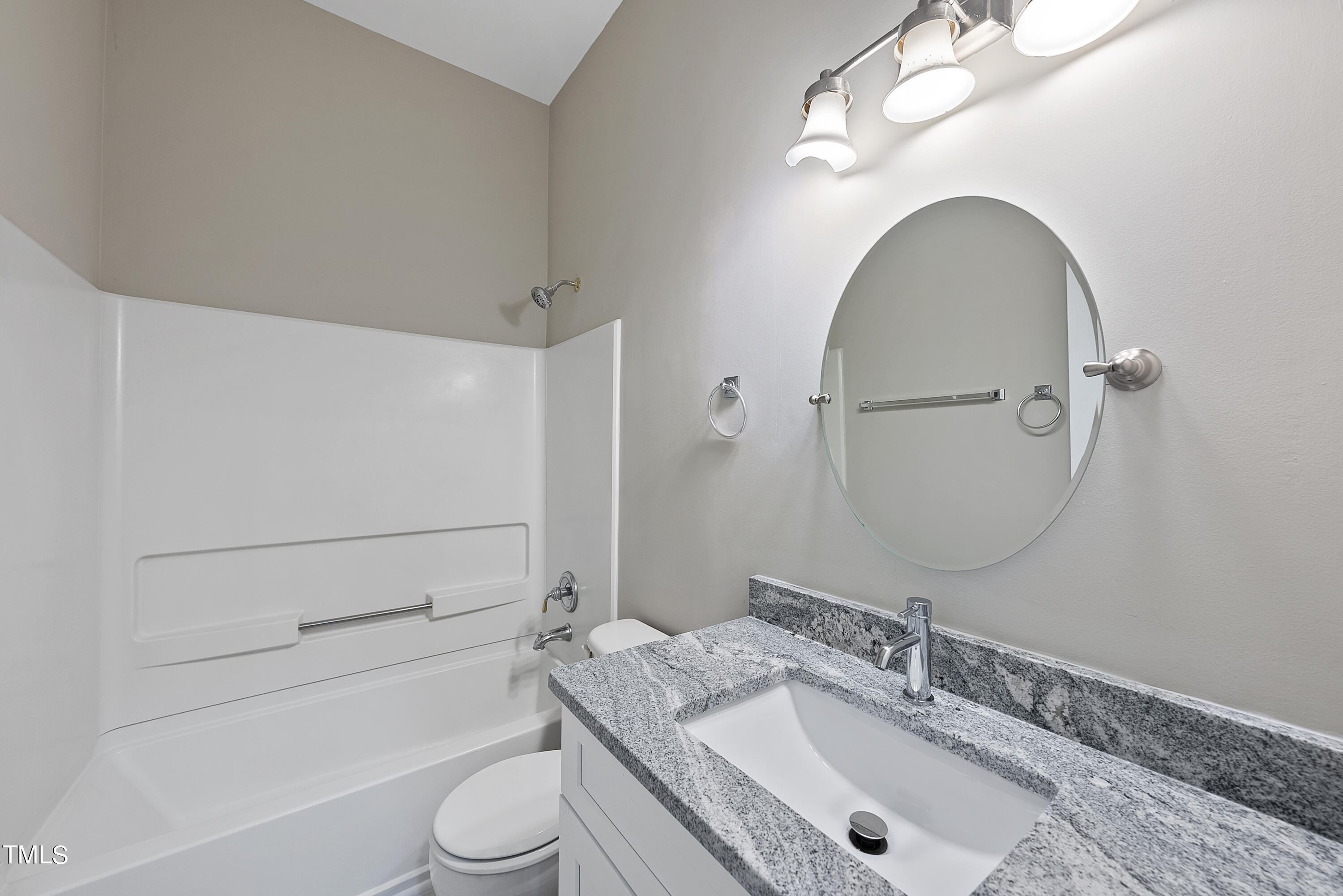 6926 Middleboro Drive Raleigh, NC 27612 - Photo 22 of 29 a bathroom with a granite countertop sink toilet and shower
