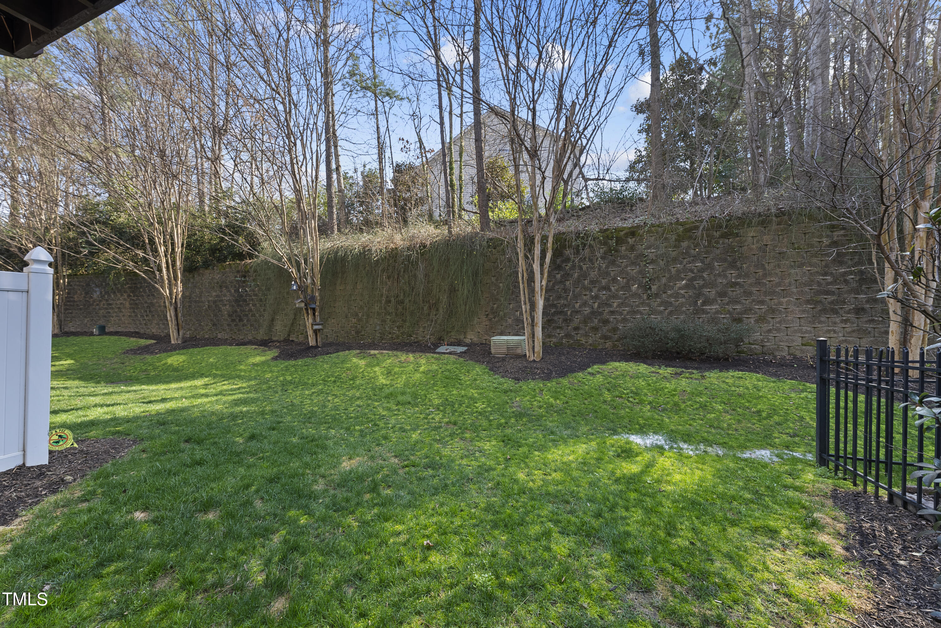 6926 Middleboro Drive Raleigh, NC 27612 - Photo 27 of 29 a view of a backyard with large trees