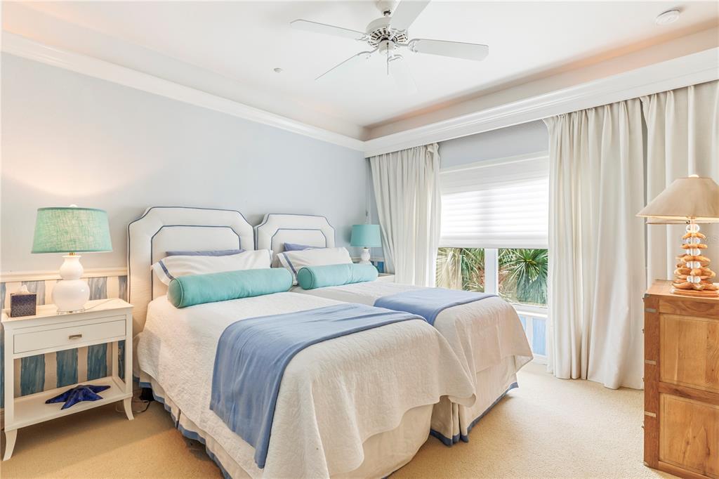 776 Beach View Drive Boca Grande, FL 33921 - Photo 11 of 36 a bedroom with a bed and a large window