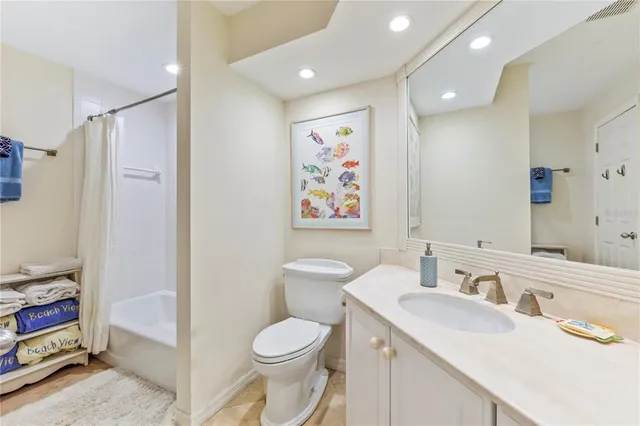 an aerial view of a swimming pool with a garden and plants