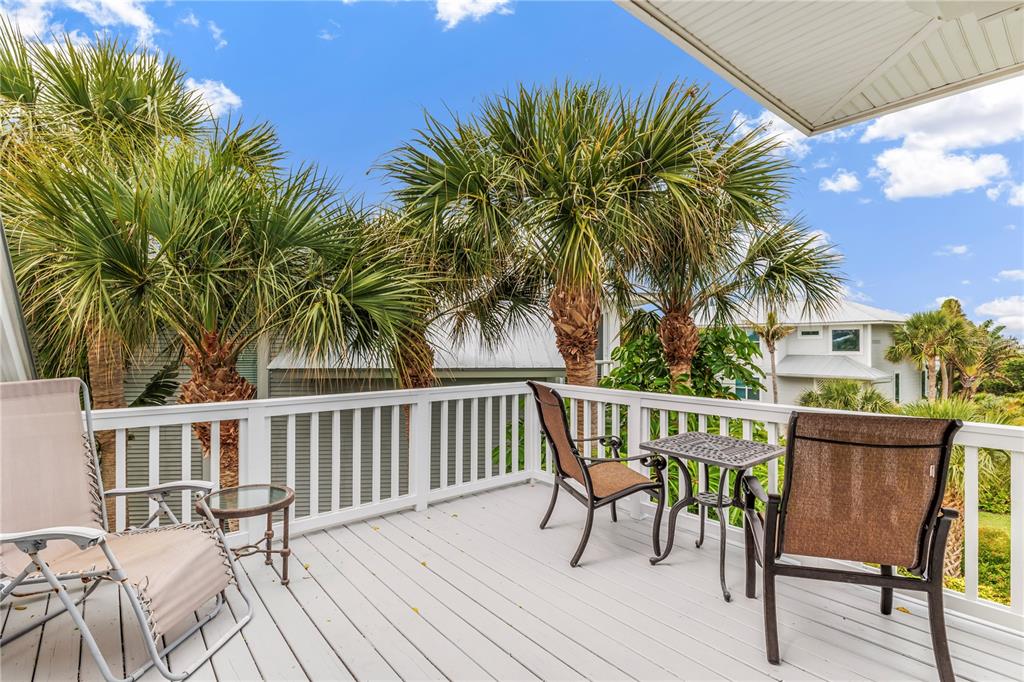 776 Beach View Drive Boca Grande, FL 33921 - Photo 19 of 36 a view of a chairs and table on the deck