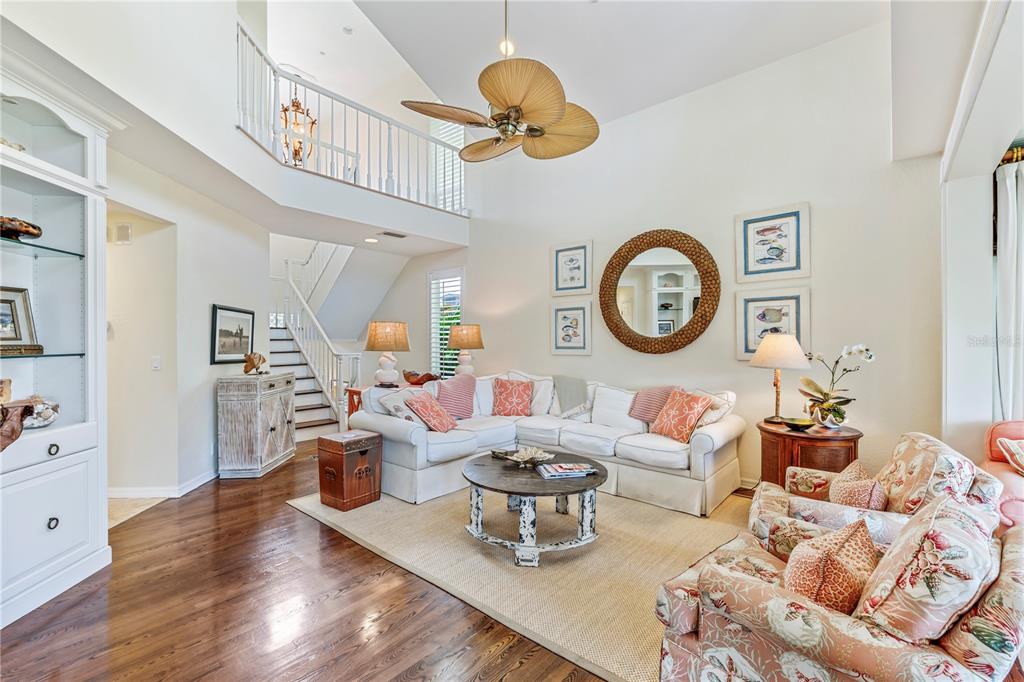 776 Beach View Drive Boca Grande, FL 33921 - Photo 6 of 36 a living room with furniture a clock and a window