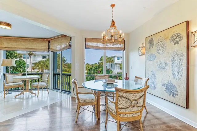 a kitchen with stainless steel appliances granite countertop a sink stove refrigerator and cabinets