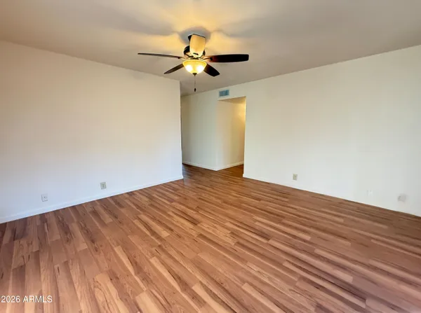 a view of a room with a wooden floor