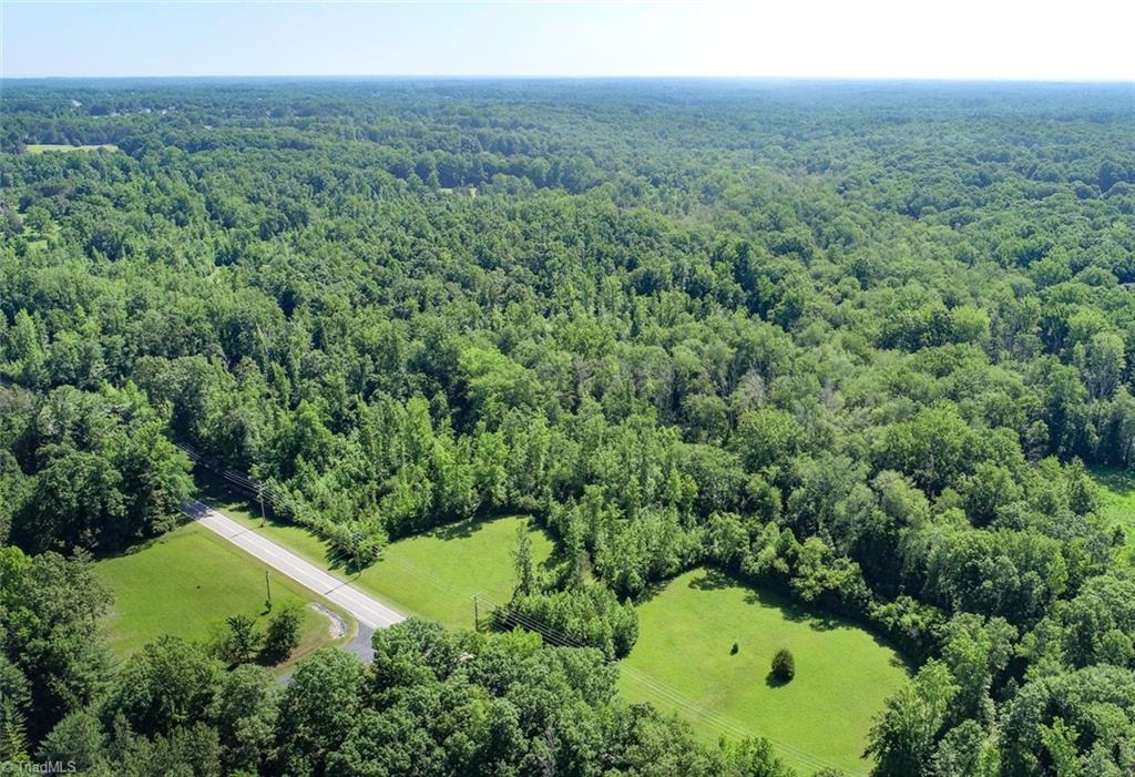 7800 Eversfield Road Stokesdale, NC 27357 - Photo 3 of 7 Aerial from front of property. There are trails throughout the land.
