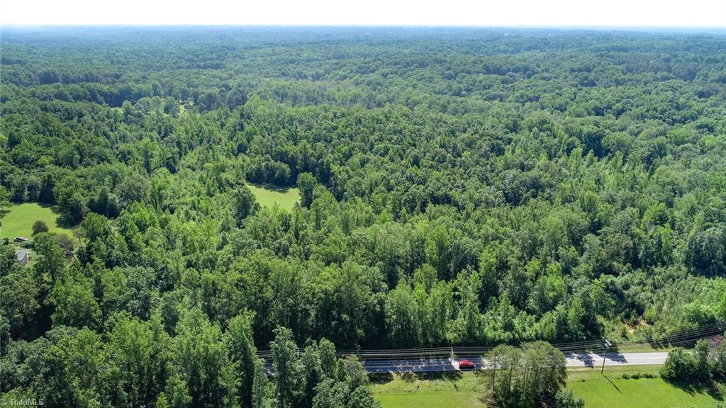 7800 Eversfield Road Stokesdale, NC 27357 - Photo 4 of 7 Aerial from across the road. Middle field is on this property. Left side boundary to tree line by field on the left. You can somewhat see the line of the river on the upper right diagonally across to the middle top of property.