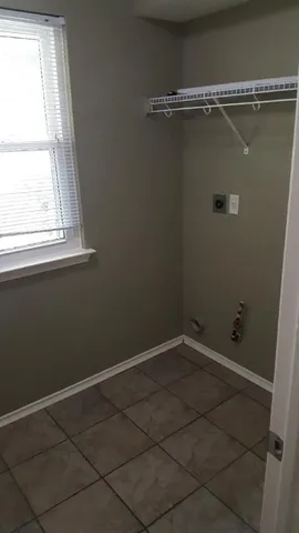 a view of a small space with racks on the wall