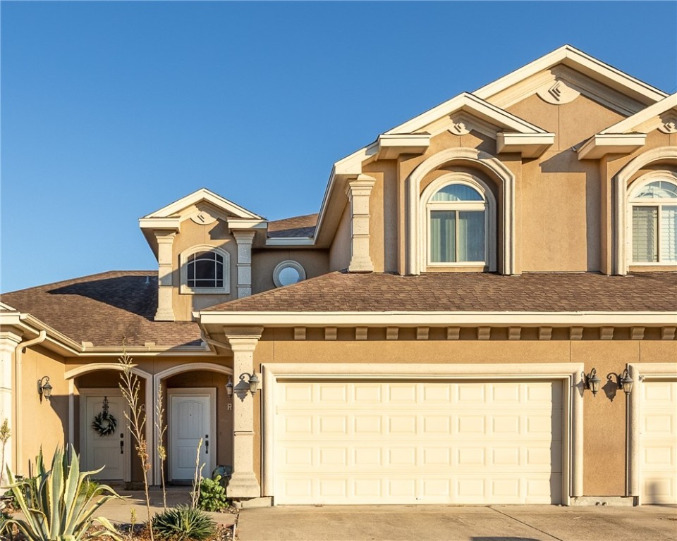 6934 Wooldridge Road, Unit R5 Corpus Christi, TX 78414 - Photo 2 of 32 a front view of a house