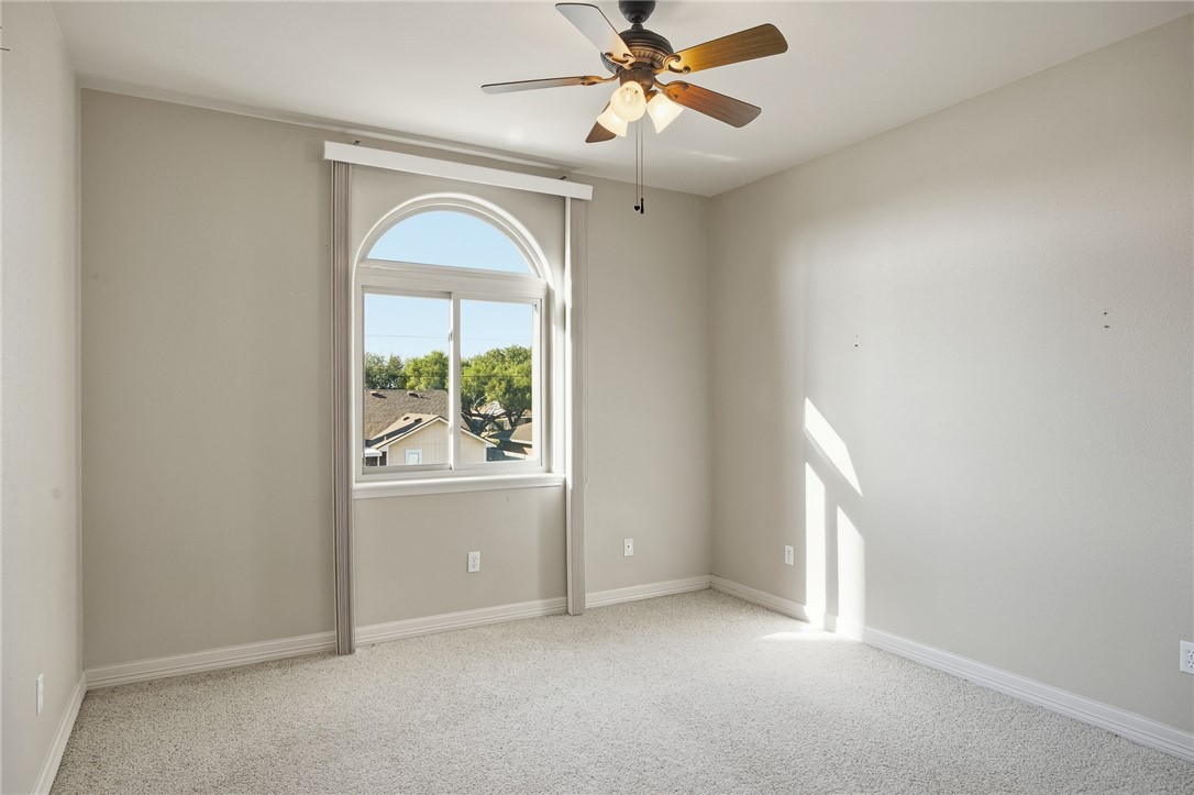 6934 Wooldridge Road, Unit R5 Corpus Christi, TX 78414 - Photo 23 of 32 an empty room with windows and closet
