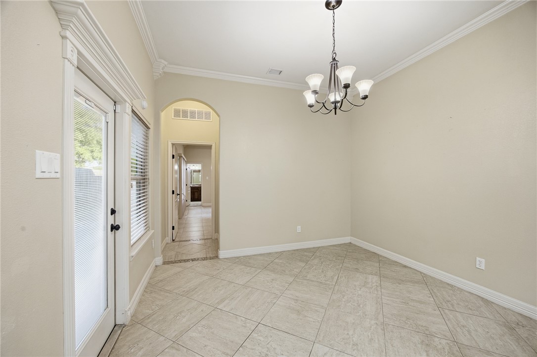 6934 Wooldridge Road, Unit R5 Corpus Christi, TX 78414 - Photo 25 of 32 a view of a chandelier in a room