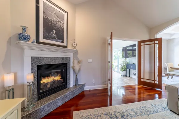 a bedroom with a bed and large window