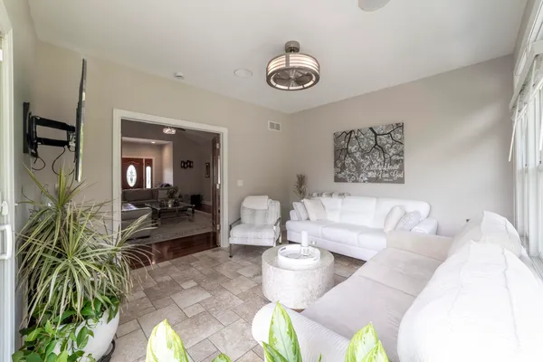 a large bedroom with bed or couch and a flat screen tv