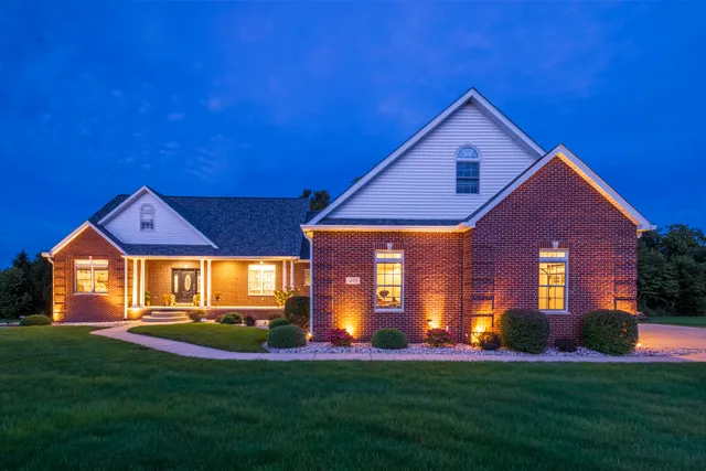 a front view of a house with a yard