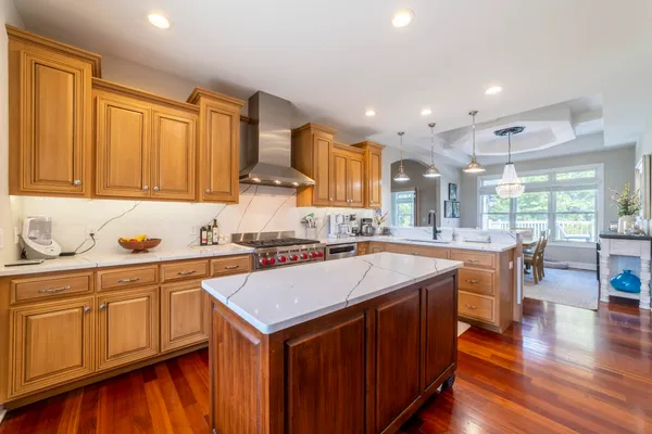 a dining room with furniture and wooden floor