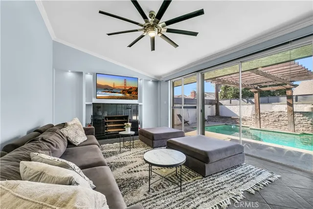 a bedroom with a bed and large window