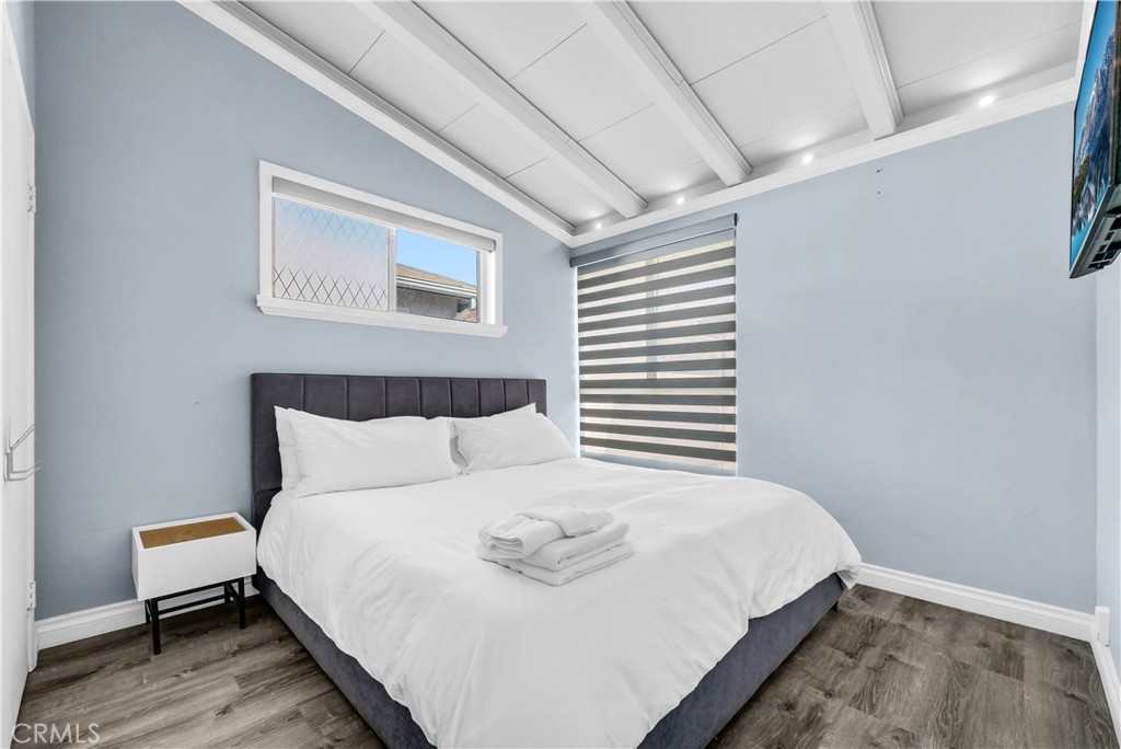 645 South Trident Street Anaheim, CA 92804 - Photo 17 of 30 a bedroom with a bed and a window