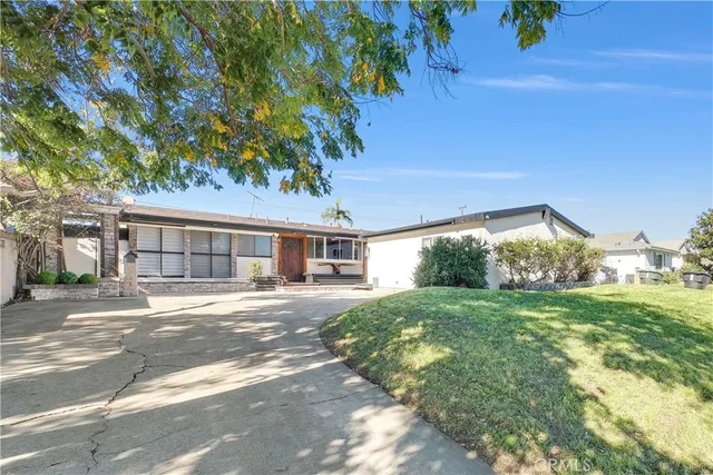 a bedroom with a bed and a table