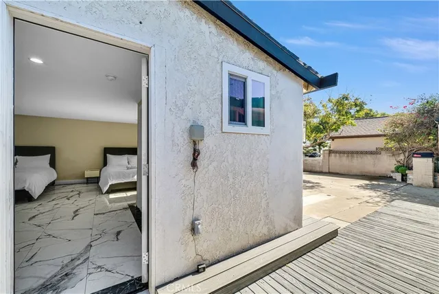 a kitchen with white cabinets and refrigerator