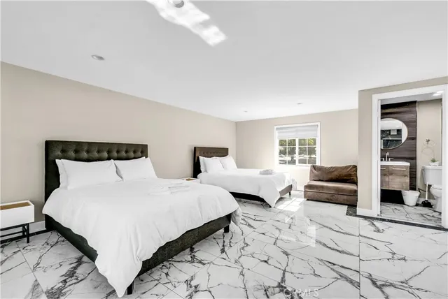 a bedroom with a bed and window