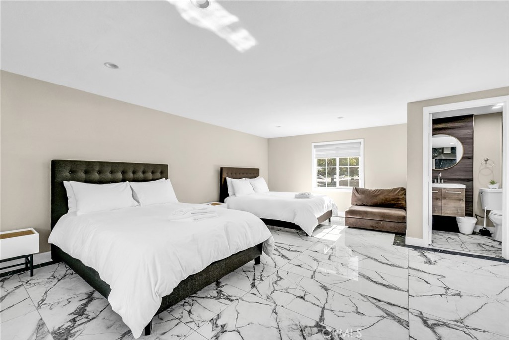 645 South Trident Street Anaheim, CA 92804 - Photo 25 of 30 a bedroom with bed and a couch