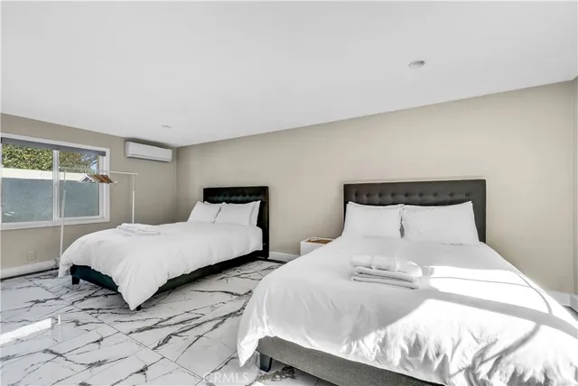 a spacious bathroom with a sink and a mirror