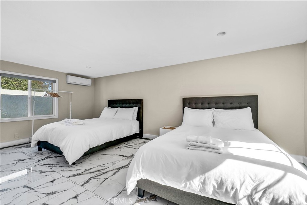 645 South Trident Street Anaheim, CA 92804 - Photo 26 of 30 a bedroom with a bed and window